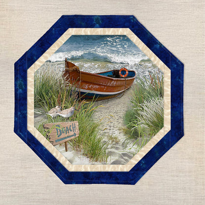 Octagon table topper features a print with a metal canoe on the side of the beach with beach, water and waves and sea grasses.