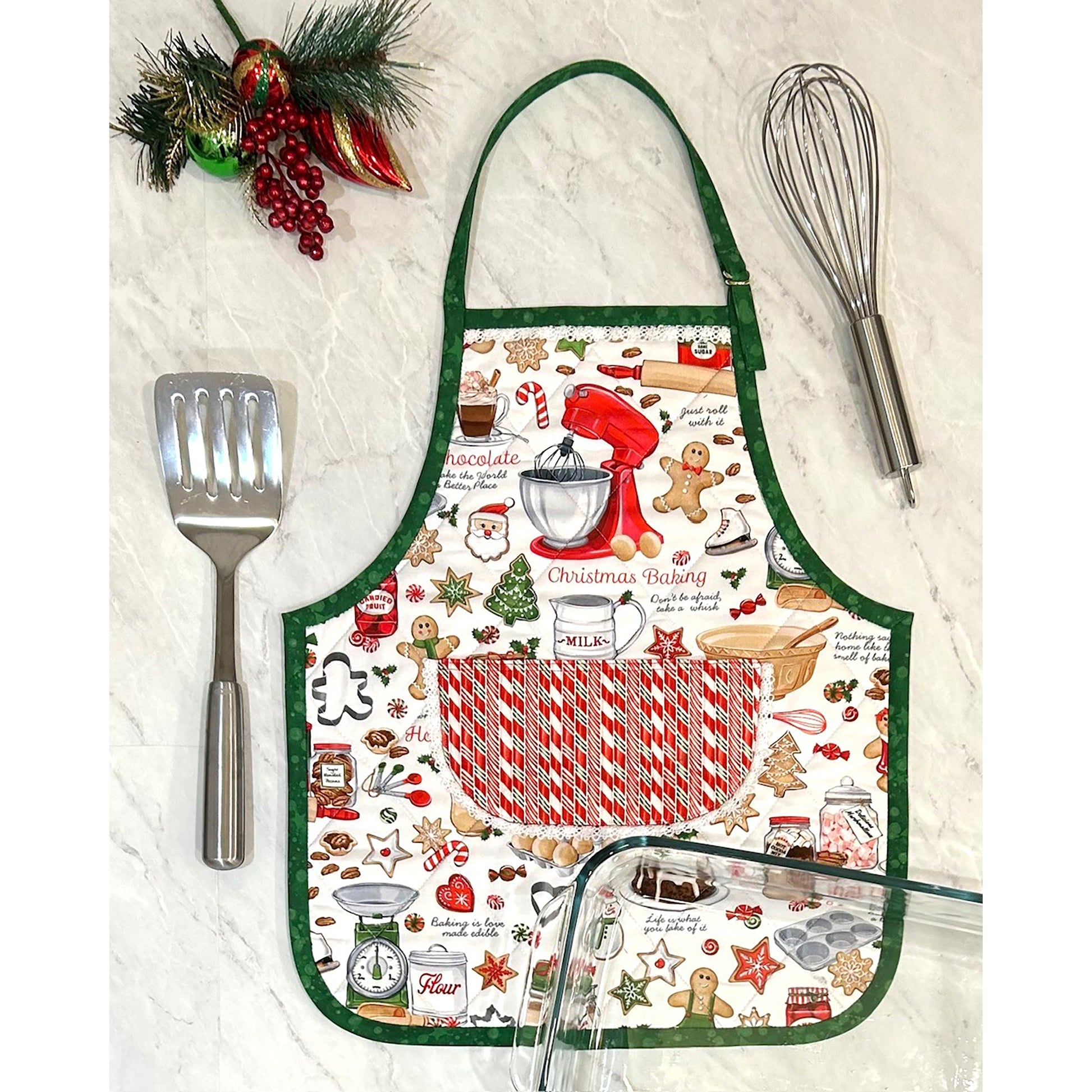 An adorable and festive apron shaped casserole hot pad featuring Christmas cookie baking fabric.