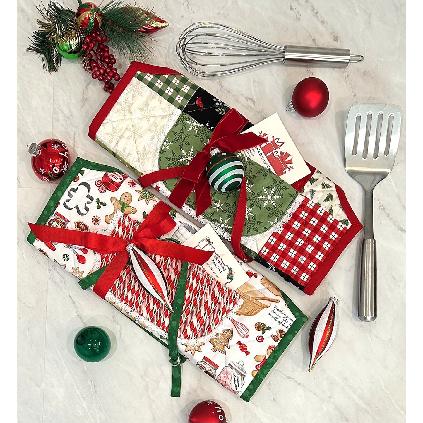 Shows two apron hot pads wrapped up to show a cute way to pack up for holiday gift giving.