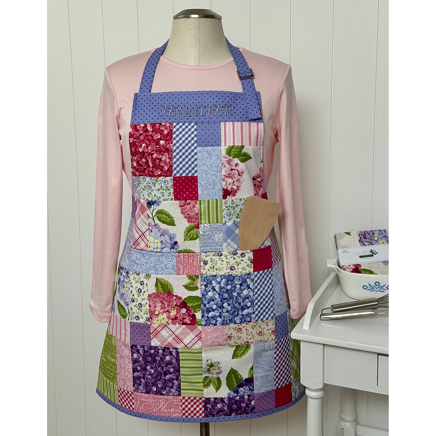 Fun charm pack apron showcasing floral prints.