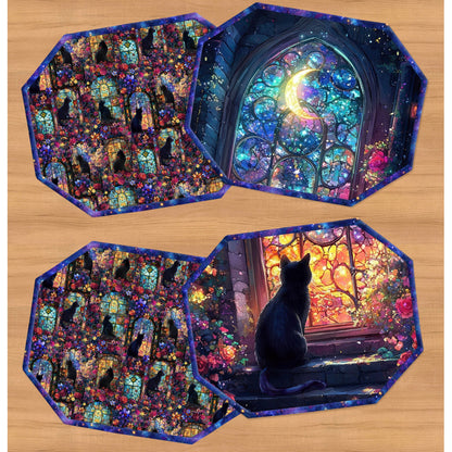 Four octagonal coasters with a dark blue border, arranged on a light wood background. Three coasters feature a repeating pattern of black cats in stained-glass windows, and one coaster shows a black cat sitting in front of a glowing stained-glass window with a crescent moon.
