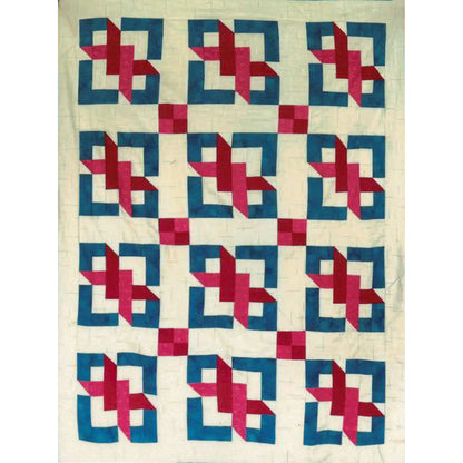 Quilt with geometric pattern of blue and pink shapes on a white background