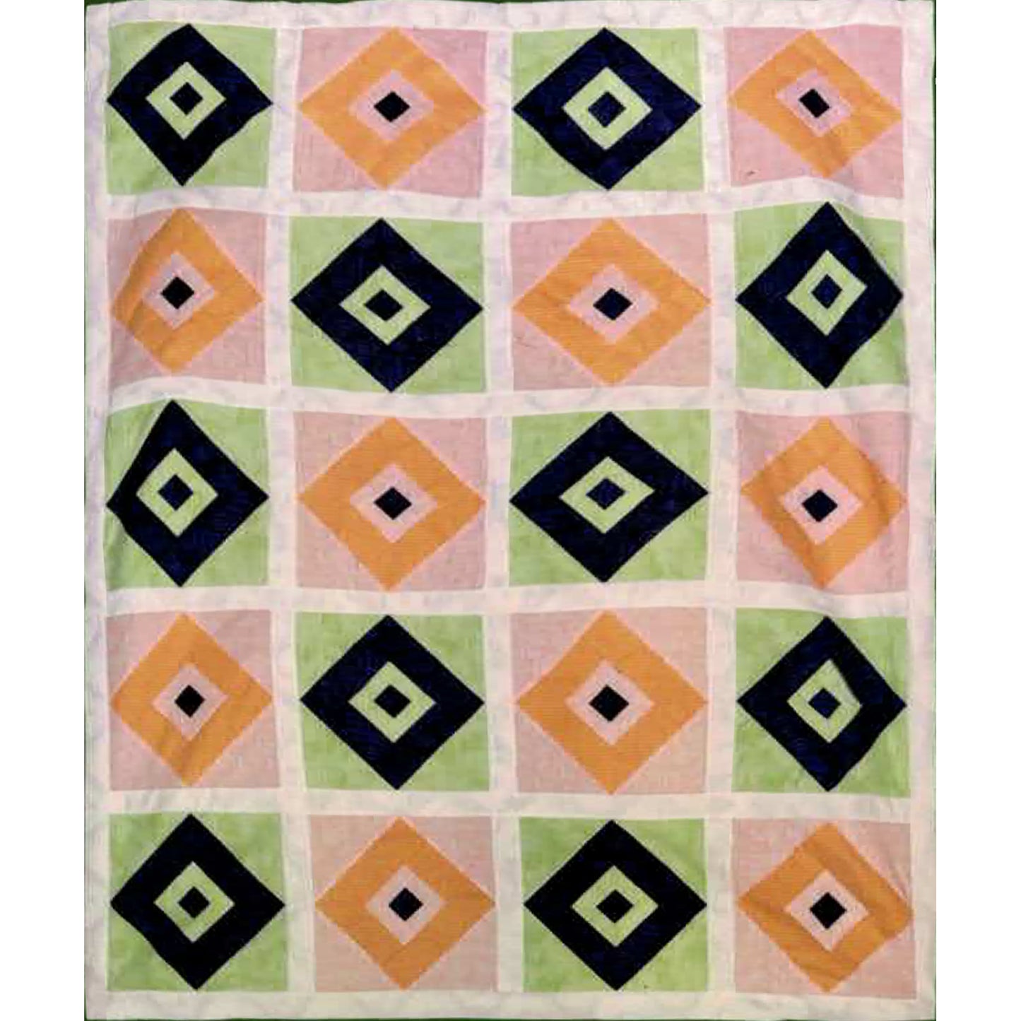 Quilt with geometric diamond pattern on a white background