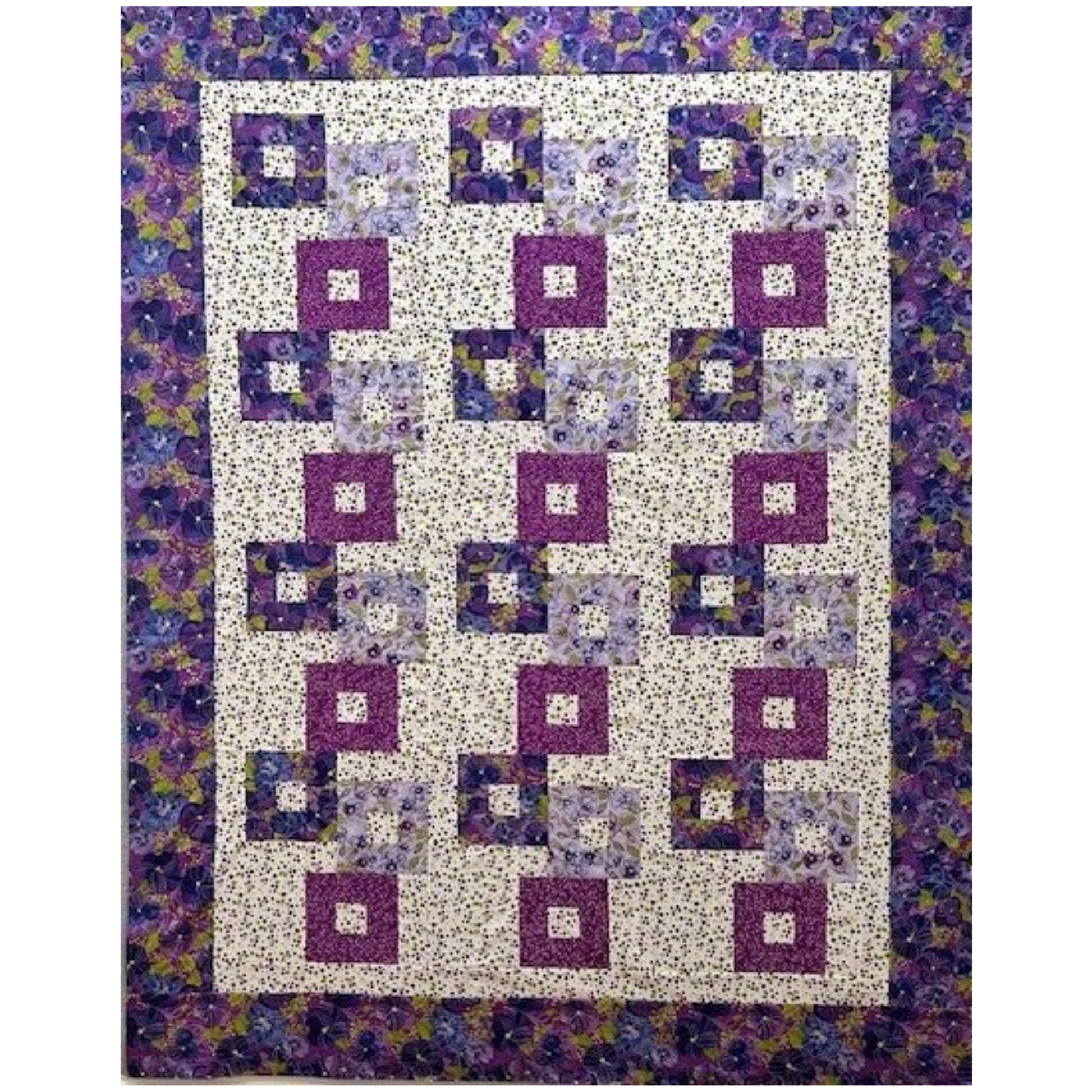 Colorful stacked blocks with opening quilt with floral prints in purples.