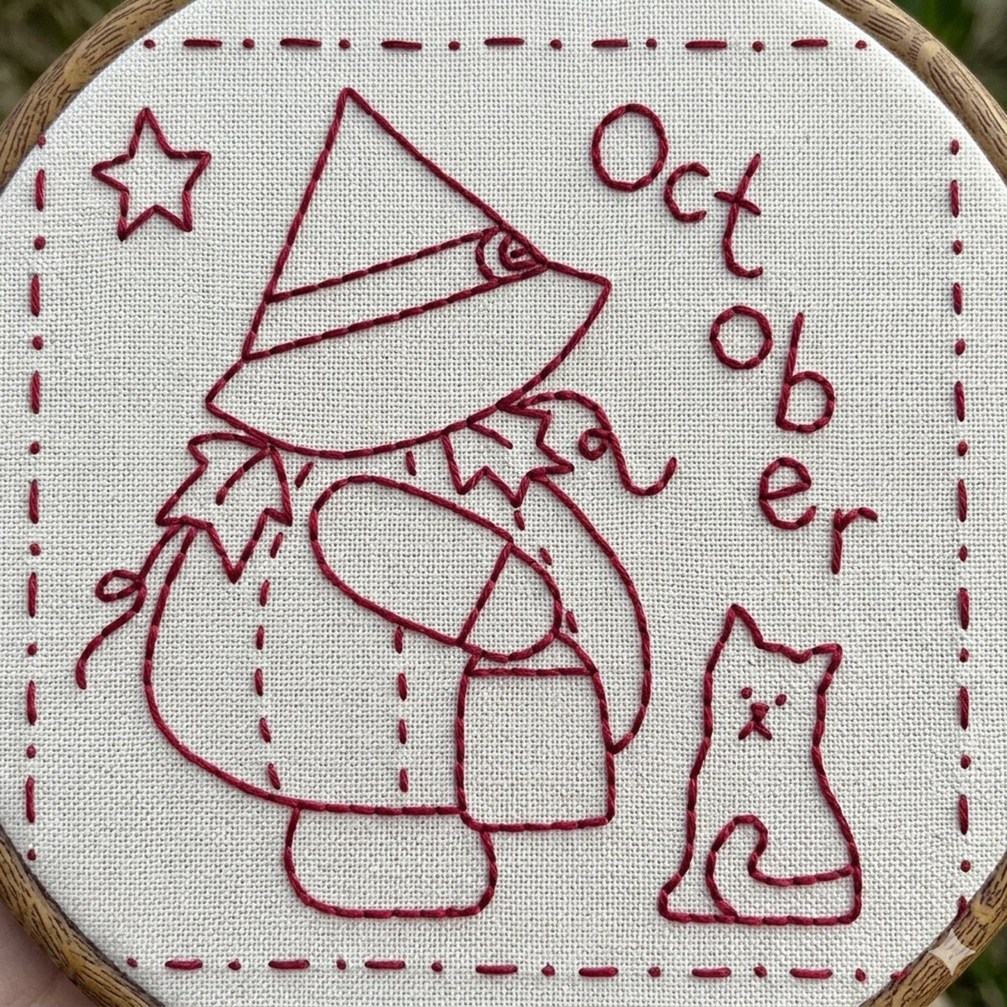 Sunbonnet Sue redwork design featuring sunbonnet sue in a pumpkin costume and witches hat. 
