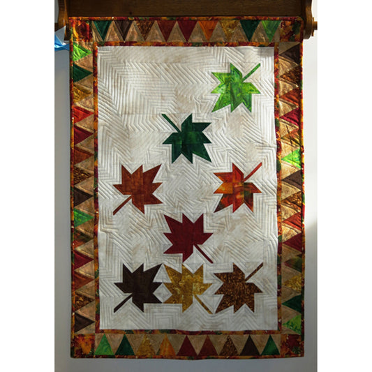 Adorable hanging quilt/wall hanging of falling maple leaves.