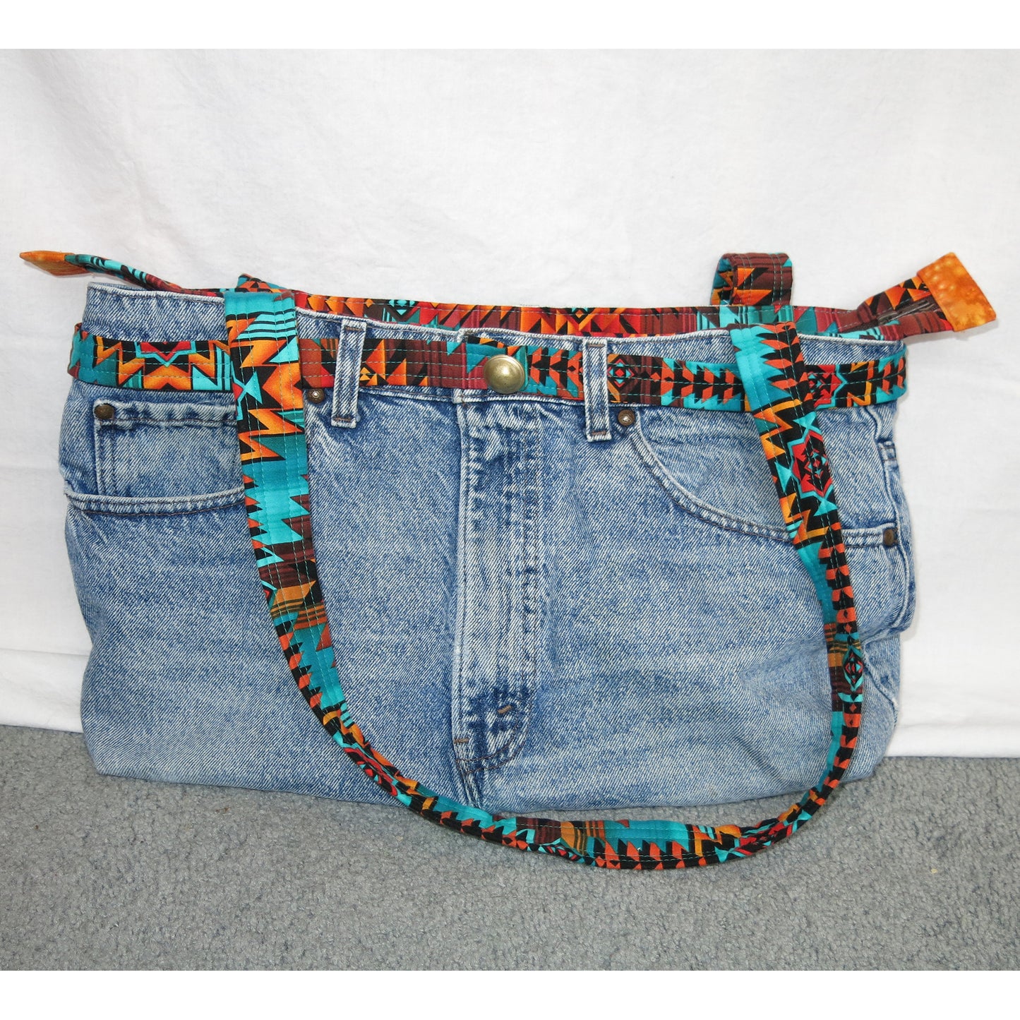 Up-cycled jeans to an adorable purse, bag or tote with handle.