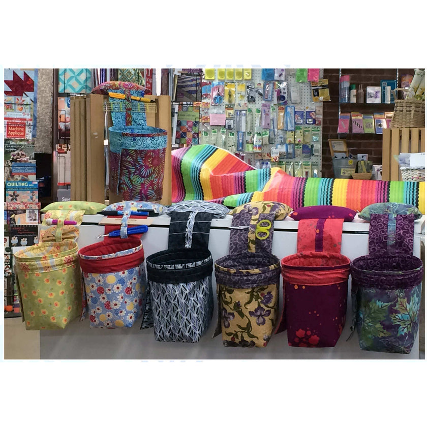 Image shows a number of the thread catchers lined up in different colors.