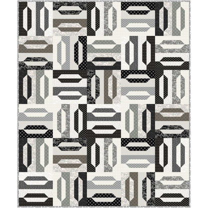 A black and white quilt displaying a variety of geometric shapes giving an elegant feel. With the black, white, and gray it looks elegant or maybe a zebra-like feel.