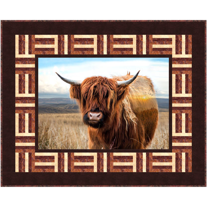 Iconic Highland cow quilt amidst rolling hills and lush landscapes in square frame.