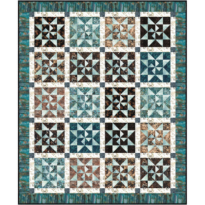 Blue and brown quilt of stars, perfect for adding a cozy touch to any room decor.