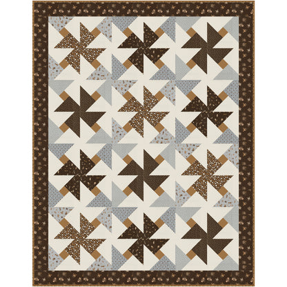 This delightful quilt features bold pinwheel blocks that seem to spin across a crisp background, creating a fresh, energetic design that beautifully showcases the fabric you choose. 