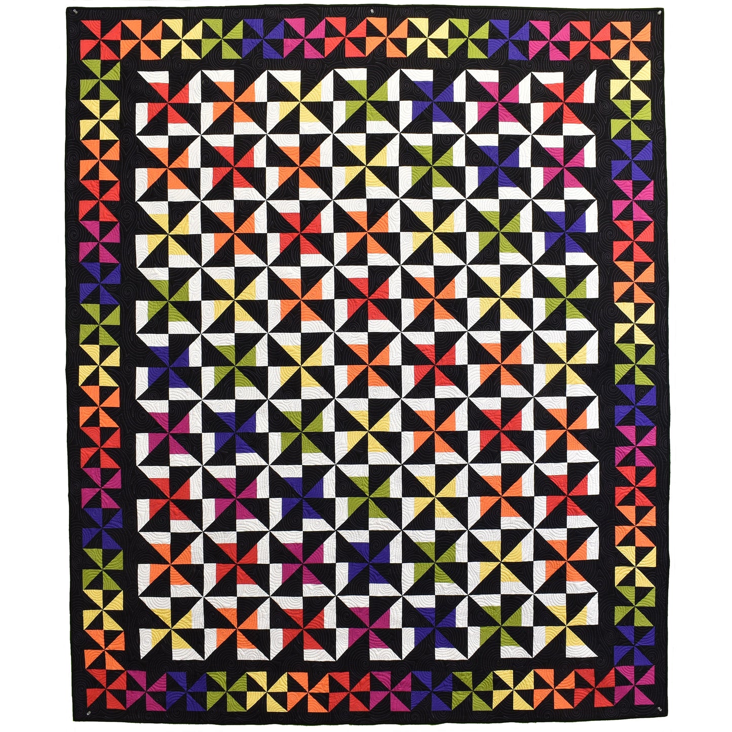 A rainbow of colored pinwheels really pops against the black background in this quilt. Yellow is the surprise color which makes your eyes dance around the border. 
