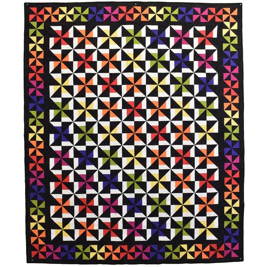 A rainbow of colored pinwheels really pops against the black background in this quilt. Yellow is the surprise color which makes your eyes dance around the border. 