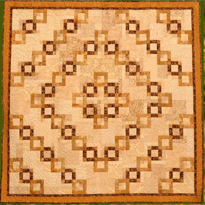 Golden chains make a romantic statement in this elegant and dramatic quilt.