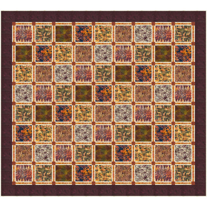 Colorful quilt with square flower and leaf pattern in shades of brown and orange.