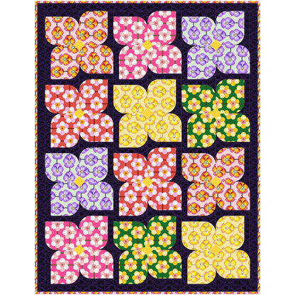 Pretty quilt features flowers of bright colored fabric.