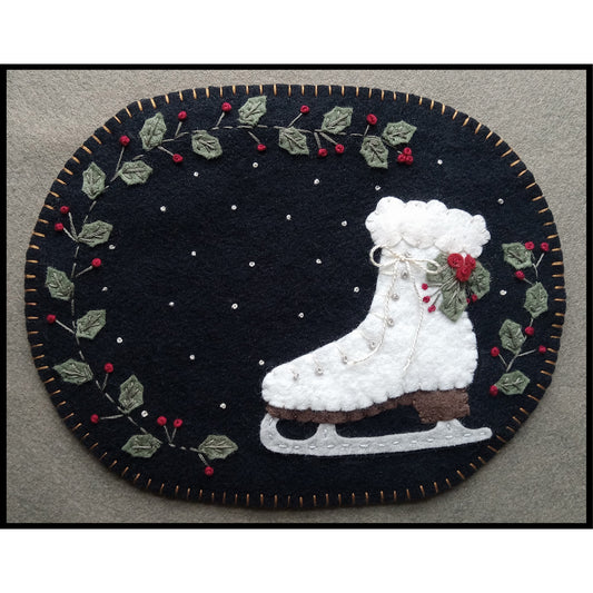 Adorable, winter Snow Day candle mat or mug rug features holly, snowflakes and an ice skate.