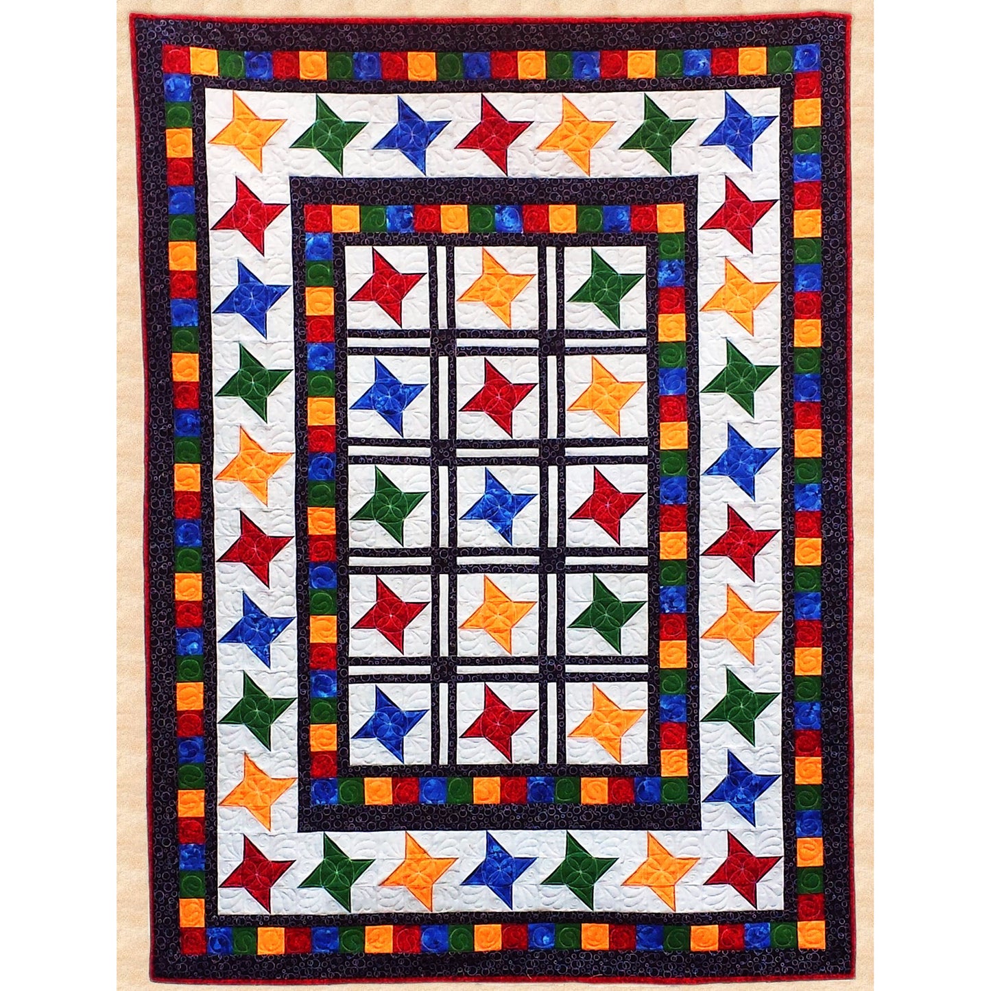 Wrap yourself up underneath these starry skies and start dreaming. Traditional Friendship Star blocks in bright colors are surrounded by multiple borders in this comfy quilt.