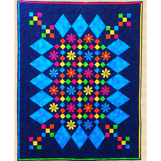 Bright and fun quilt features diamonds of light blue border with bright colored flowers and diamonds inside with a few nine-patch of five bright colors bleeding into the corners. 
