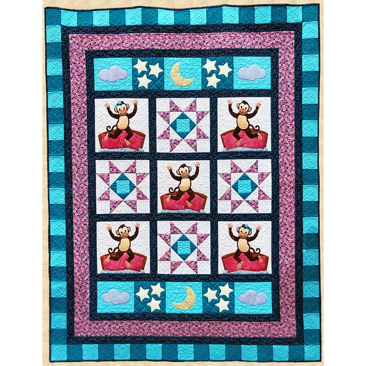 A colorful quilt featuring a playful monkey jumping on the bed and star blocks.