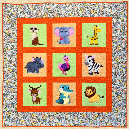 Bright, fun animal quilt features cartoon-cute animals including a meerkat, elephant, giraffe, rhinoceros, ostrich, zebra, kudu, crocodile and lion.