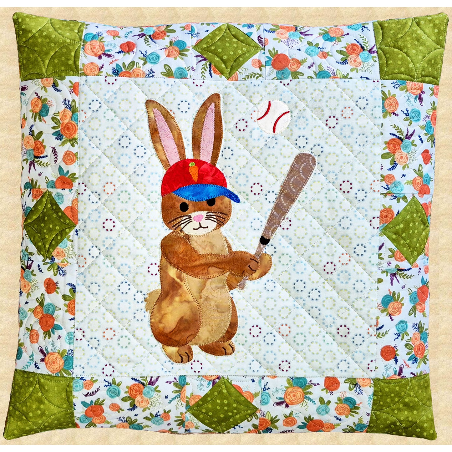 A playful appliqué bunny steps up to the plate in this cheerful pillow: bat in hand and ready for action.