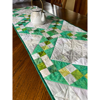 Jacob's Well table runner is a pretty runner with patched diamonds and zig-zagged 4-patch squares.