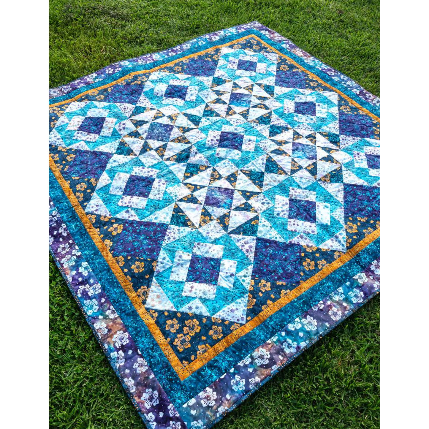 Two basic blocks make this quilt shine – and the pieced setting triangles give it a special sparkle! 