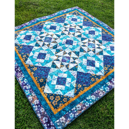 Two basic blocks make this quilt shine – and the pieced setting triangles give it a special sparkle! 