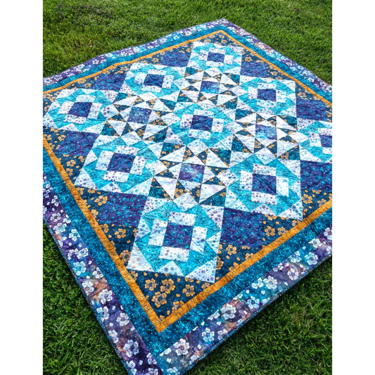 Two basic blocks make this quilt shine – and the pieced setting triangles give it a special sparkle! 