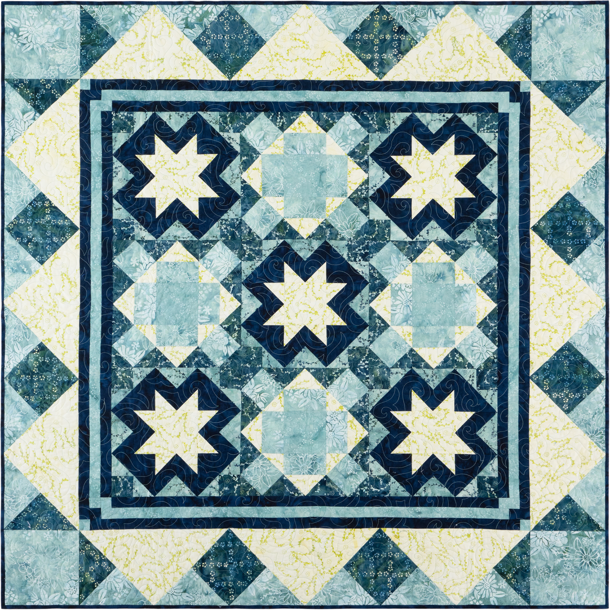 This quilt has a traditional, symmetrical layout with a wintery, frosty feel thanks to the cool blues and soft yellows in the fabrics. It features a three-by-three layout using two alternate blocks, giving it a mosaic look. 