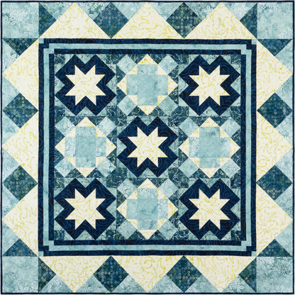 This quilt has a traditional, symmetrical layout with a wintery, frosty feel thanks to the cool blues and soft yellows in the fabrics. It features a three-by-three layout using two alternate blocks, giving it a mosaic look. 