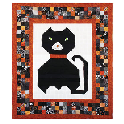 Adorable quilt features a cat in the middle of a patchwork border.