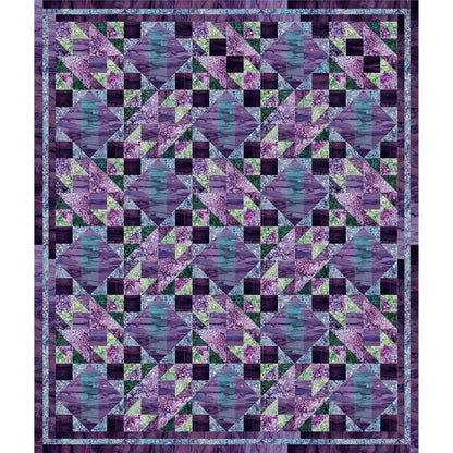 Fun quilt of different sized diamonds in different shades of blue, purple, and green fabric.
