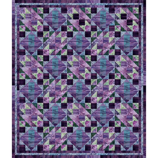 Fun quilt of different sized diamonds in different shades of blue, purple, and green fabric.