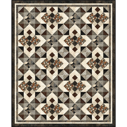 A quilt pattern displaying a harmonious blend of brown and black colored fabric with different textures.