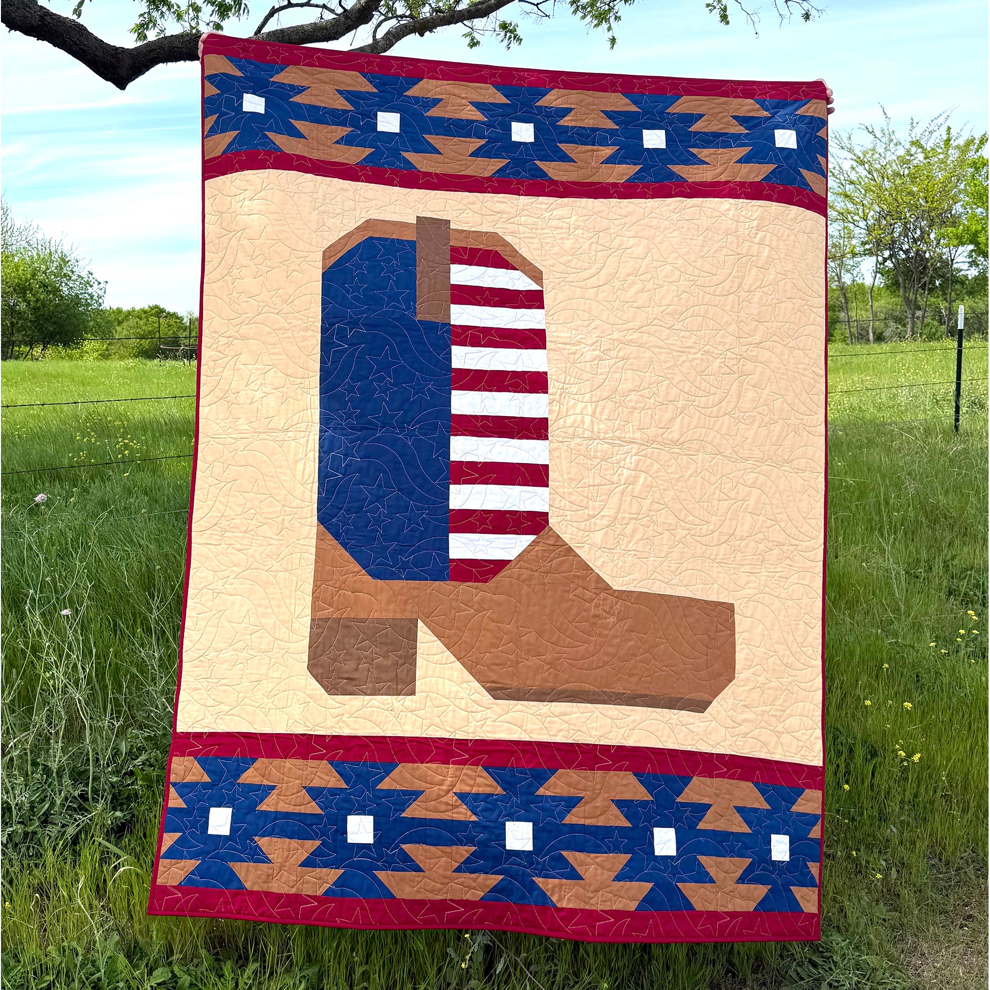 The Heartland Boot quilt is a reflection of our roots that are deep in the Heartland of America. Designed for all the farmers, ranchers and a life tied directly to the land. This quilt is in red, white and blue.