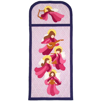 Beautiful quilted wall hanging features 5 angels in a window. They are playing different instruments and each have a hallow, dress in shades of pink, and brown hair.