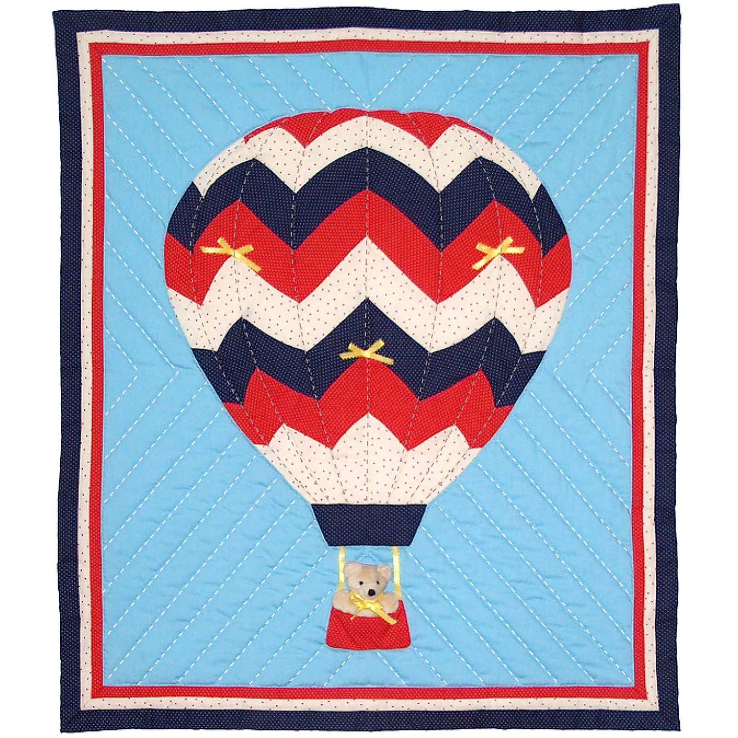 Adorable wall quilt with a hot hair balloon in red, white, and blue. In the basket is a teddy bear.