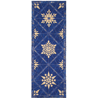 Beautiful and detailed quilted table runner with snowflakes and geometric quilt stitches. Runner is blue with three different cream snowflakes in the middle and the sides with ends of more.