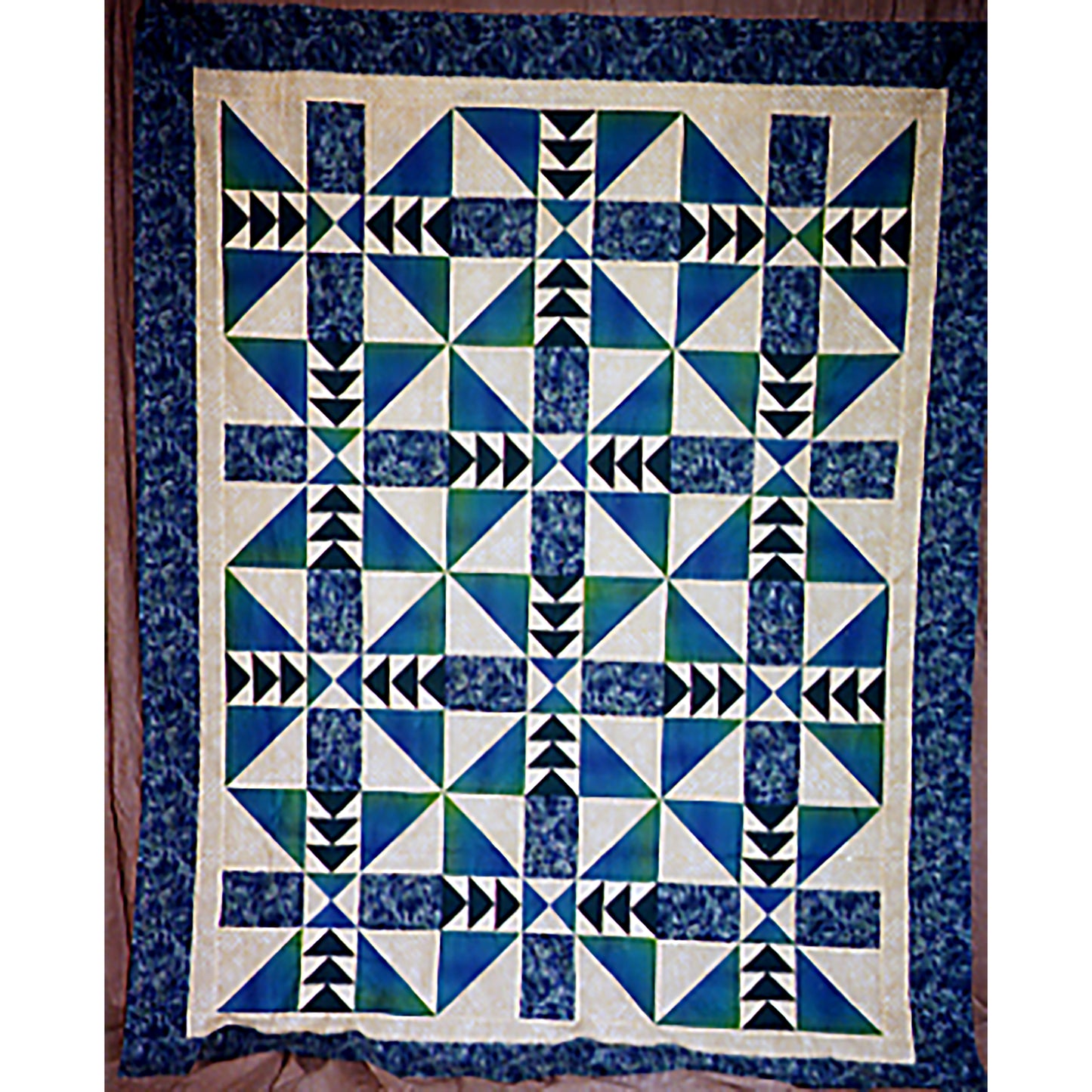  Beautiful, pieced, one-block quilt. Blocks are alternately rotated with triangles on the corners and flying geese in the middle.