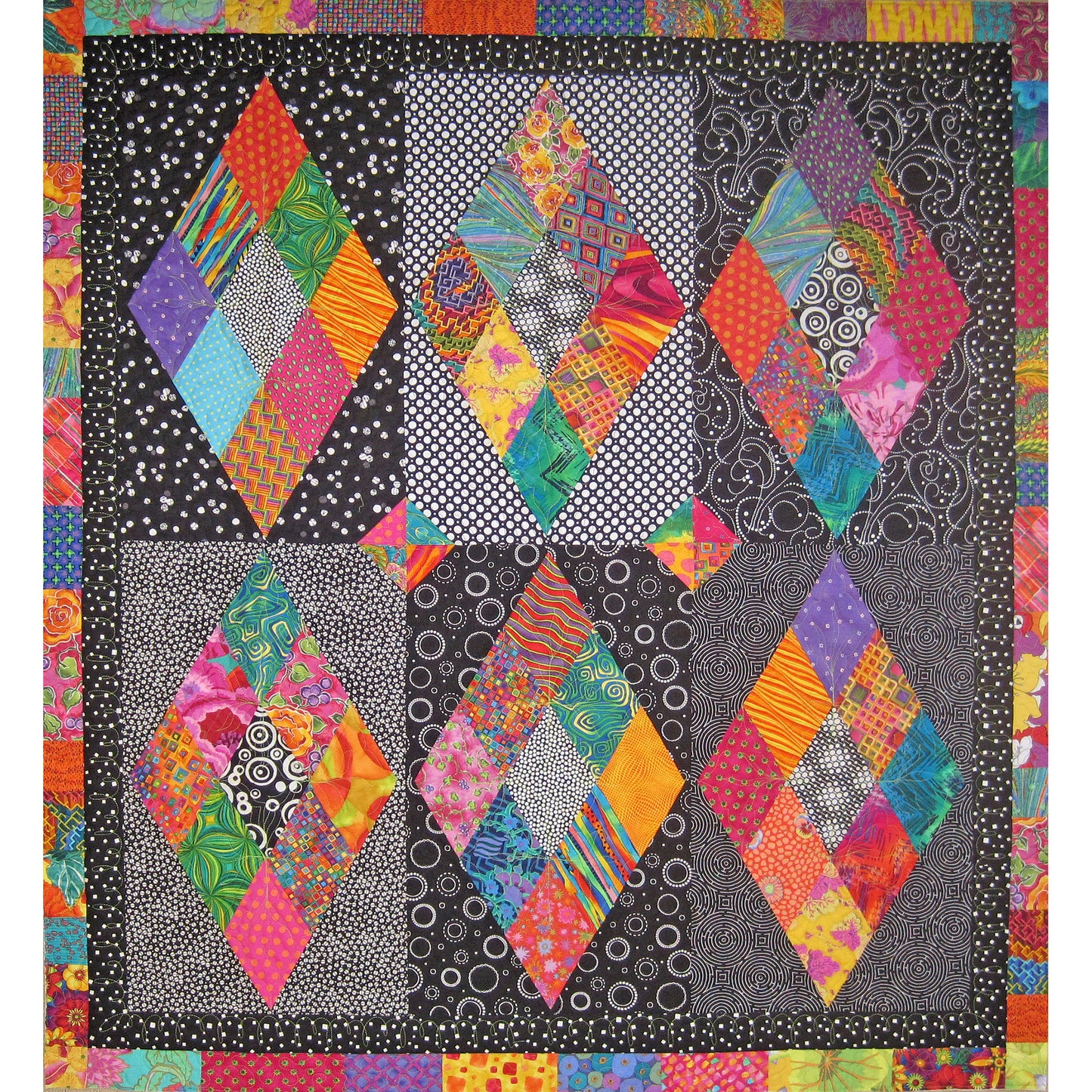 You will put a sparkle in someone's eye when you present them this quilt with the background in a variety of black and white prints, the diamonds pop right off the quilt with their bright colors.