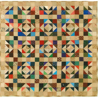 Colorful quilt with geometric pattern on a beige background