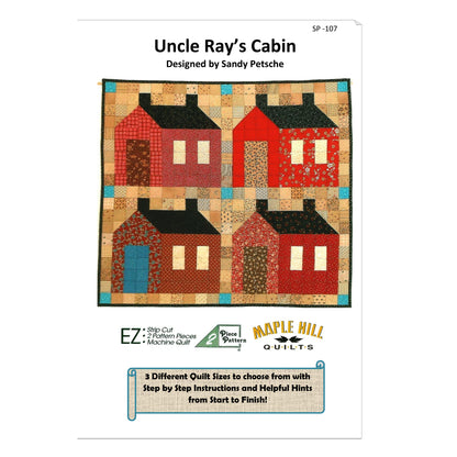 Quilt pattern packaging for 'Uncle Ray's Cabin' by Sandy Petsche, featuring colorful houses on a white background.