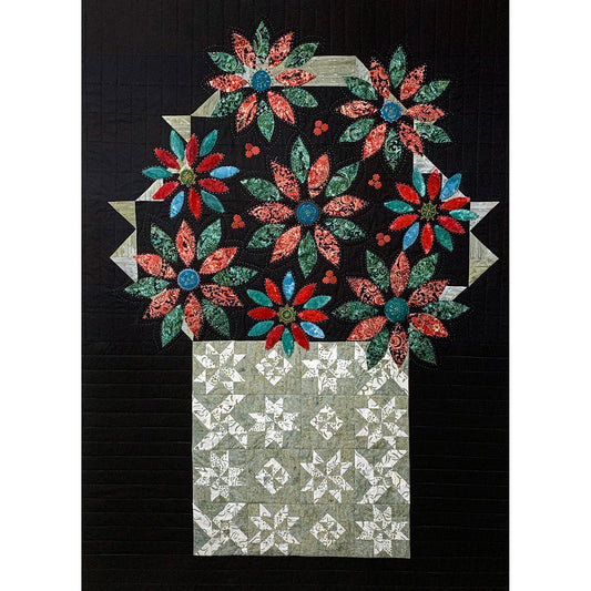 Beautiful quilt features a basket of sampler blocks overflowing with colorful poinsettia's in lots of fun colors.