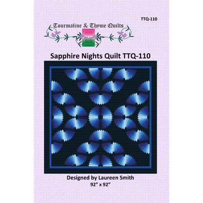 Quilt pattern packaging for 'Sapphire Nights' quilt by Tourmaline & Thyme Quilts with blue geometric design on a purple background.
