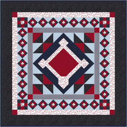 Quilt with geometric pattern featuring red, blue, and black on a white background