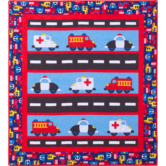 Fun and bright emergency vehicle quilt with three rows of fire truck, ambulance and police card on a road of black with white center line and colorful vehicles border fabric.