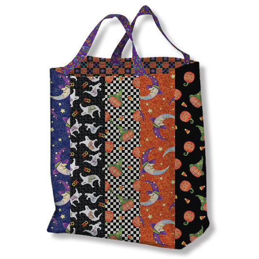 A large tote bag featuring stripes of Halloween fabric, perfect for carrying essentials in style, Halloween Candy, or both.